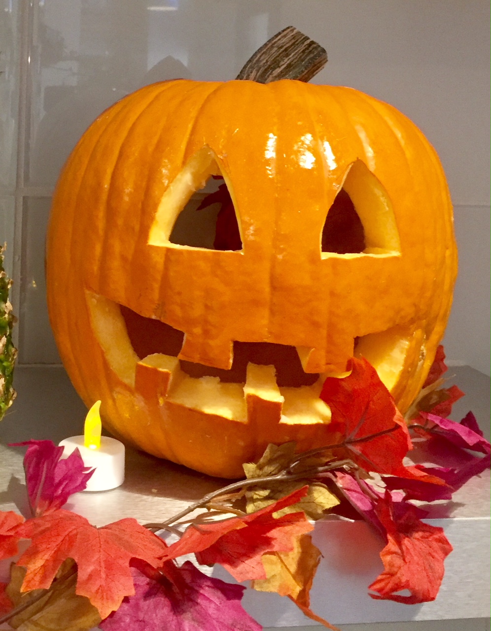traditionally carved pumpkin with a link to FALL DECOR IDEAS by JANE